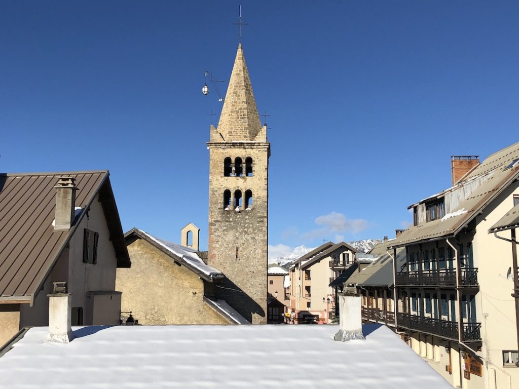 Sunny skies frame the historic heart of Montgenèvre